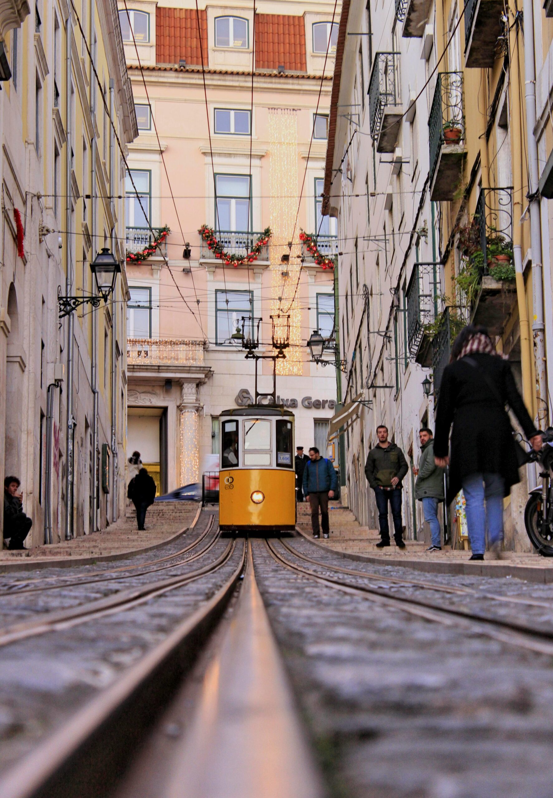 Charming tram on Rua da Bica in Lisbon, Portugal, offering a glimpse into the city's unique urban transport system.